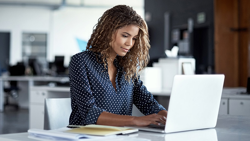 Woman looking at her laptop